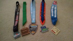 Finisher medals from 5 half marathons in 8 weeks.
